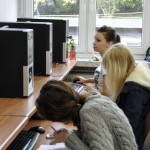 Three students sit and study using computers in the studio of the ZSP in Lublin. Clicking on the image thumbnail will display the enlarged photo.